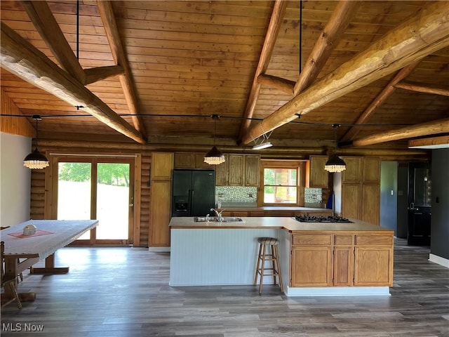 kitchen with dark hardwood / wood-style flooring, black fridge with ice dispenser, wood ceiling, and hanging light fixtures