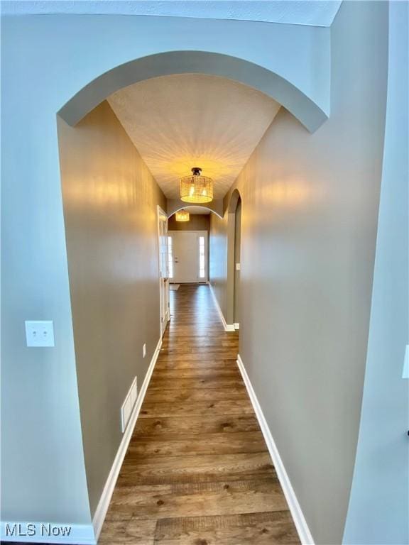 corridor featuring hardwood / wood-style flooring