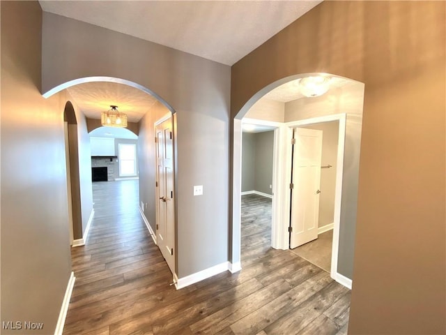 hallway with wood-type flooring