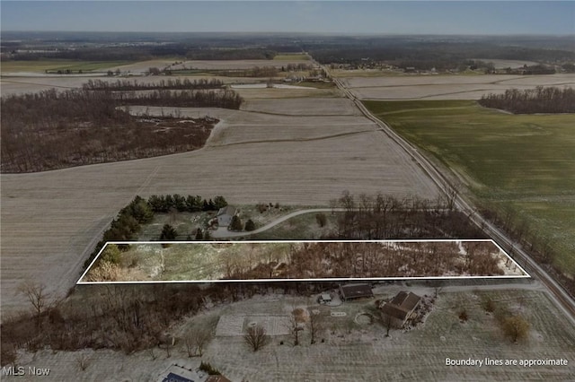 birds eye view of property with a rural view