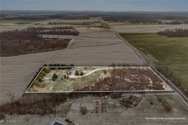 birds eye view of property featuring a rural view