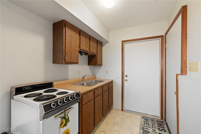 kitchen featuring white electric range oven and sink