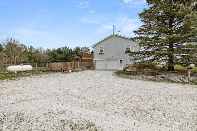 view of property exterior featuring a garage