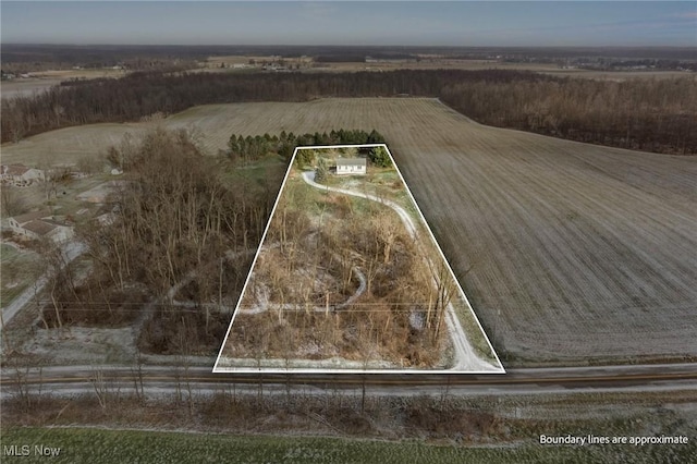 birds eye view of property with a rural view