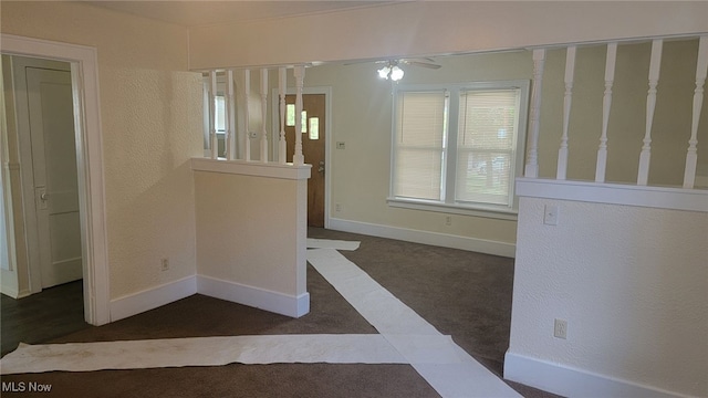 interior space with a wealth of natural light and ceiling fan