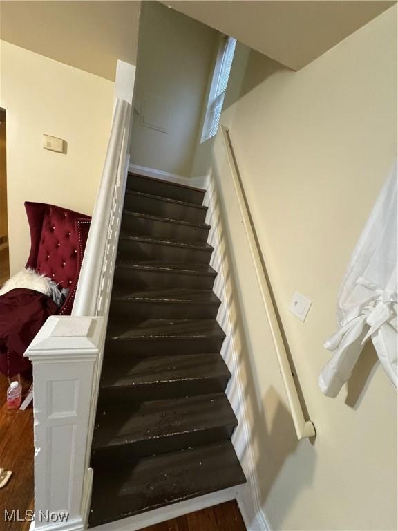 staircase featuring hardwood / wood-style floors