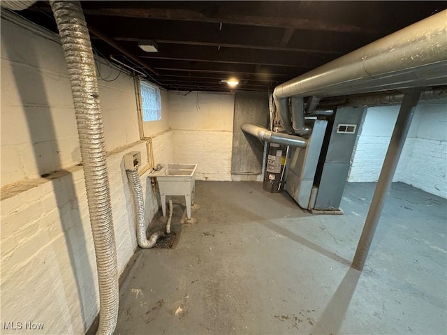 basement featuring water heater