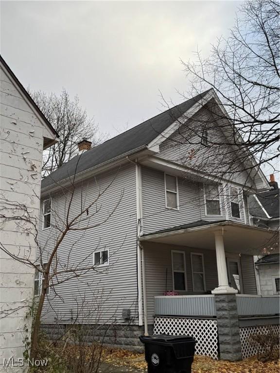 view of property exterior featuring a porch