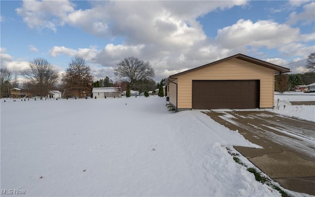 view of front facade with an outbuilding and a garage