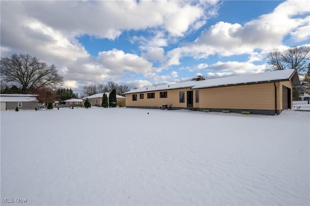 view of snow covered house