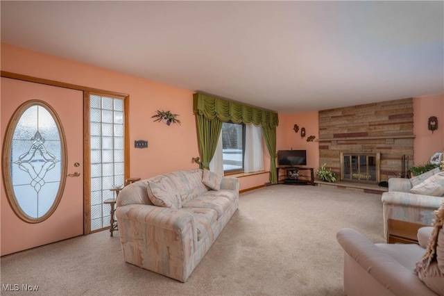 living room featuring a stone fireplace and light carpet