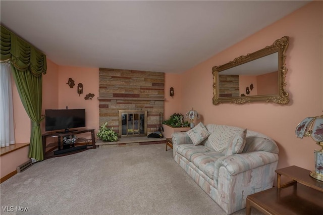 carpeted living room with a stone fireplace