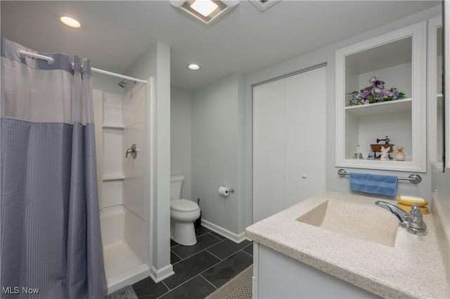 bathroom with curtained shower, tile patterned flooring, vanity, and toilet