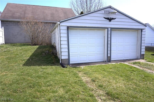 garage with a yard