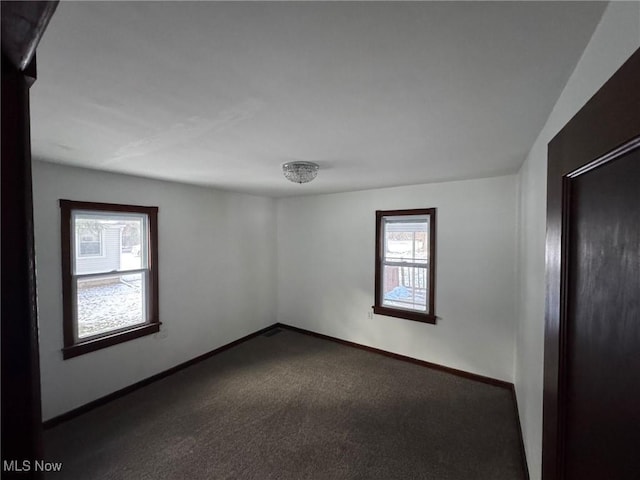 carpeted empty room with a wealth of natural light