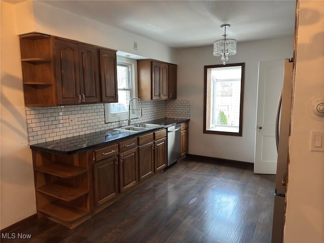 kitchen with backsplash, stainless steel dishwasher, sink, dark brown cabinetry, and dark wood-type flooring