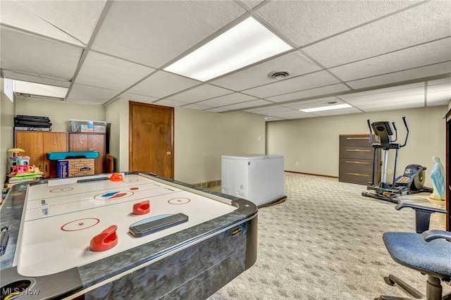 rec room featuring a paneled ceiling and carpet floors