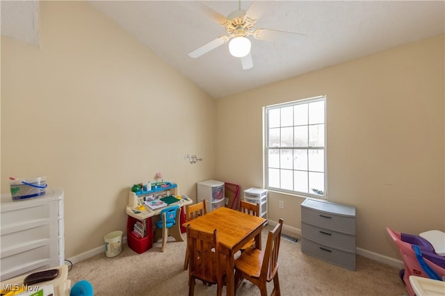 playroom with ceiling fan, light carpet, and vaulted ceiling