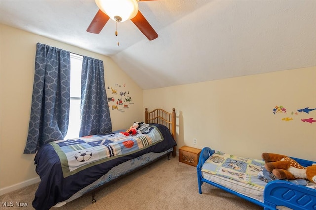 bedroom with ceiling fan, light colored carpet, and lofted ceiling