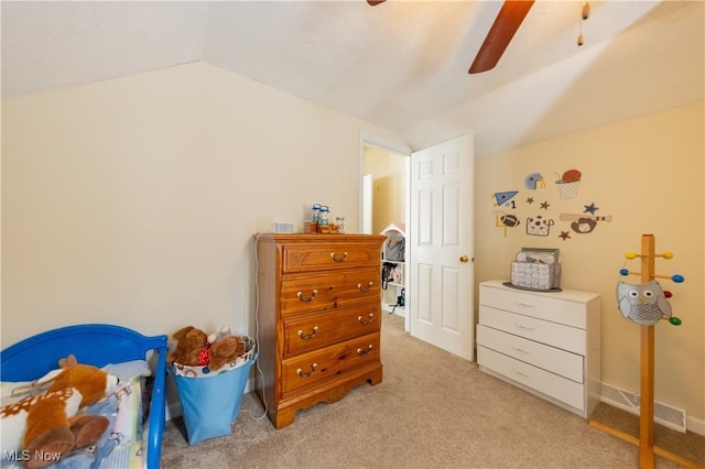 bedroom featuring ceiling fan, light colored carpet, and lofted ceiling