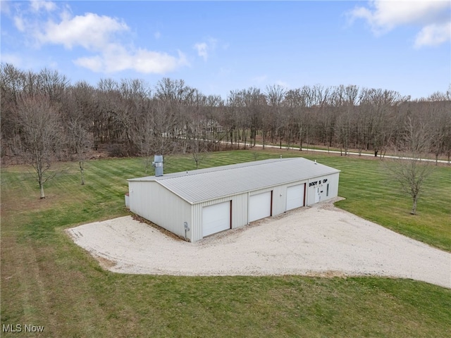 exterior space featuring a yard and a garage