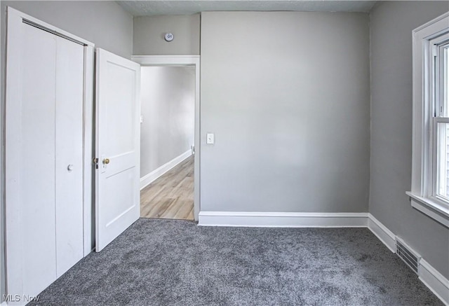 unfurnished bedroom featuring carpet