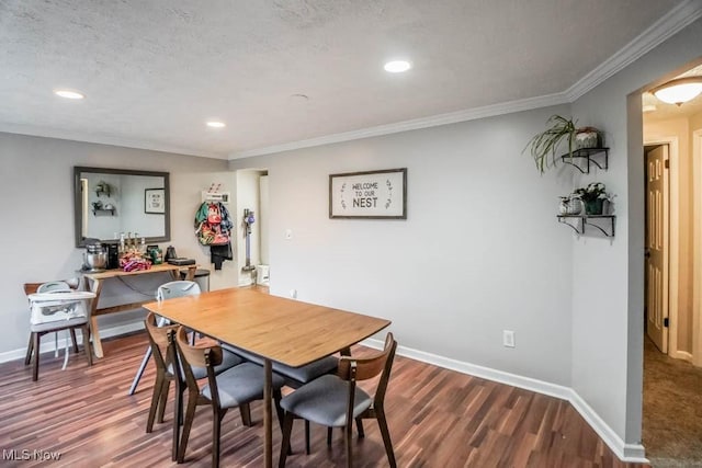 dining area with crown molding, hardwood / wood-style floors, and a textured ceiling