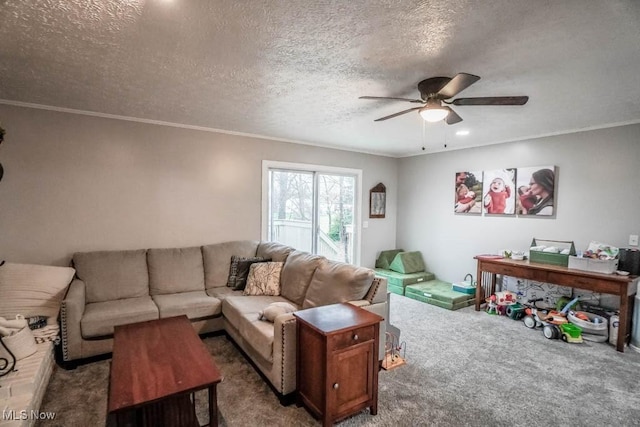 living room with carpet flooring, ceiling fan, a textured ceiling, and ornamental molding