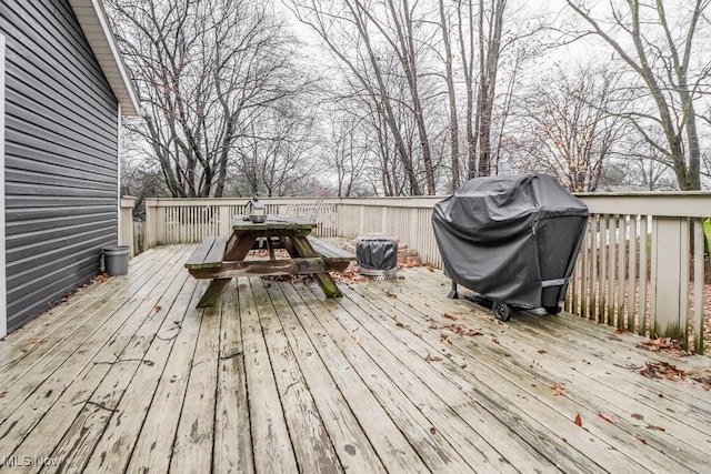 wooden deck featuring area for grilling