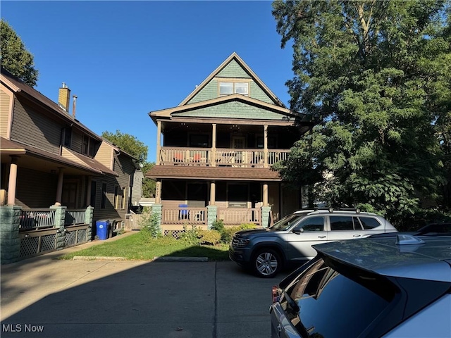 view of front facade featuring a porch and a balcony