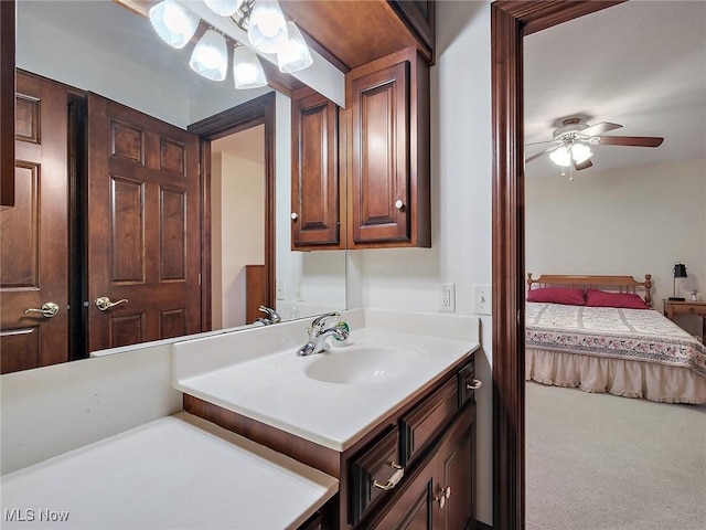 bathroom with ceiling fan and vanity