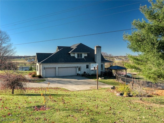 view of home's exterior with a lawn and a garage