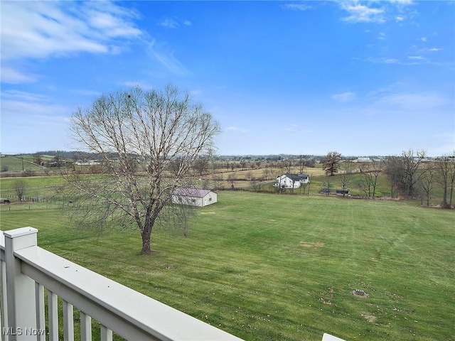 view of yard with a rural view