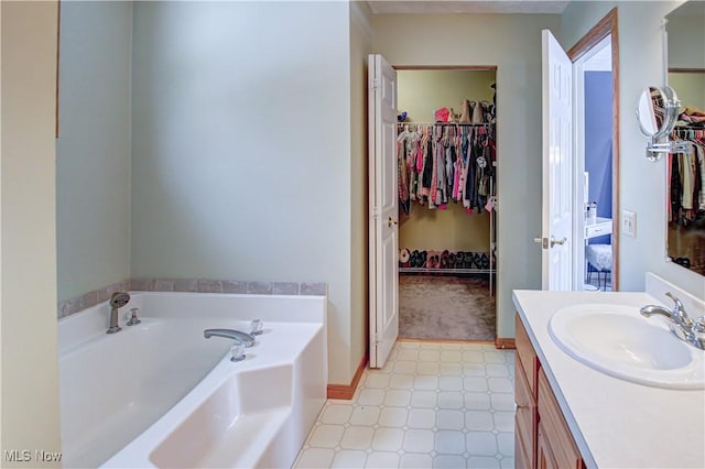 bathroom featuring vanity and a bathtub