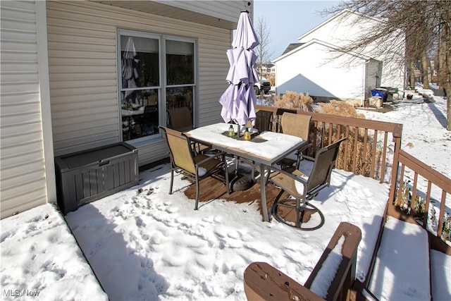 view of snow covered deck