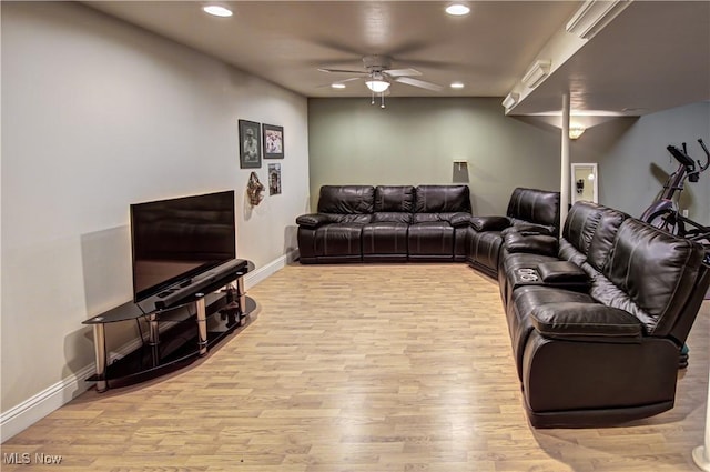 living room featuring ceiling fan and light hardwood / wood-style floors