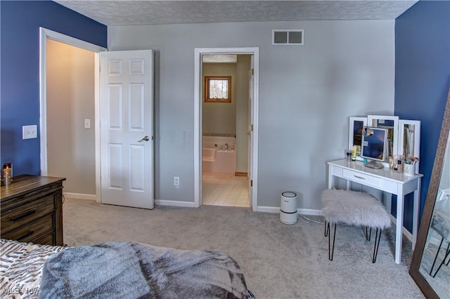 carpeted bedroom featuring a textured ceiling