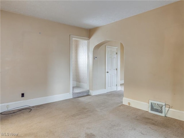 spare room with light carpet