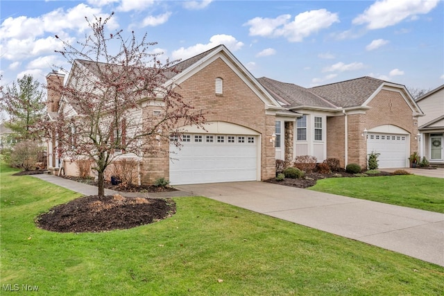 view of front of house featuring a front yard and a garage