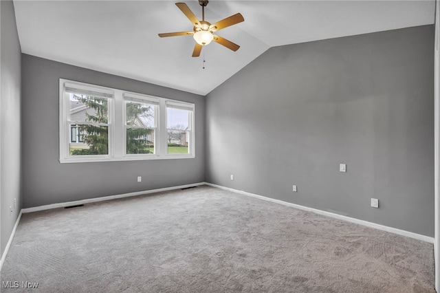 unfurnished room with ceiling fan, carpet, and vaulted ceiling