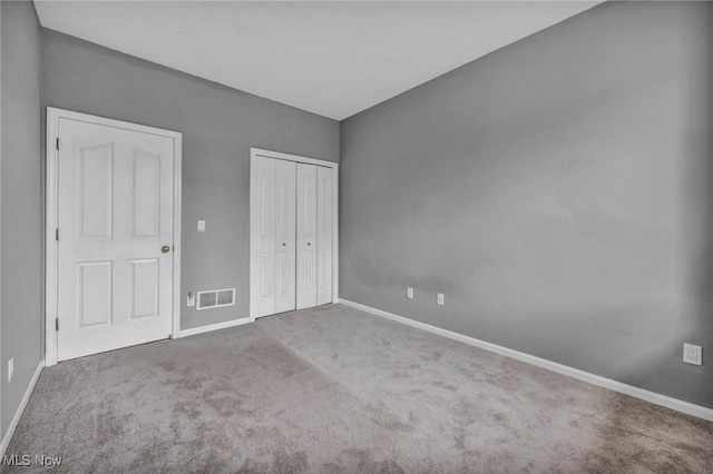 unfurnished bedroom featuring carpet