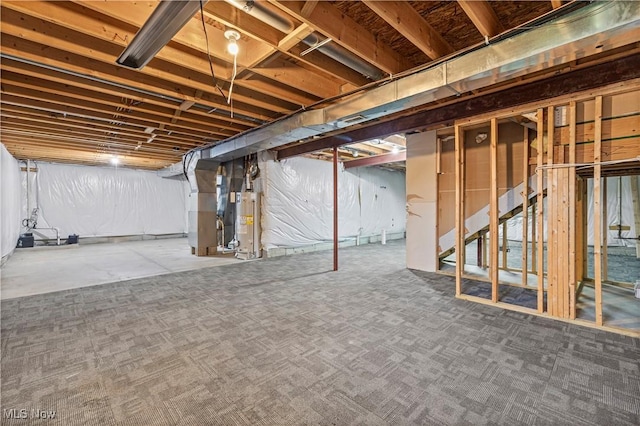 basement with heating unit and gas water heater