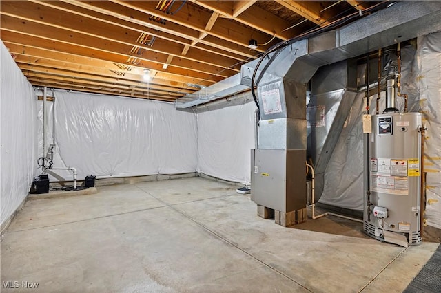 basement featuring heating unit and water heater