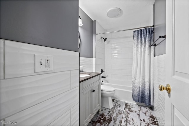 full bathroom with vanity, shower / bath combo, and toilet