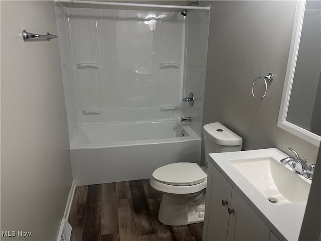 full bathroom with vanity, wood-type flooring, bathtub / shower combination, and toilet