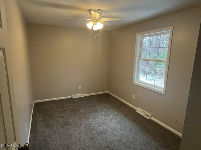 carpeted empty room featuring ceiling fan