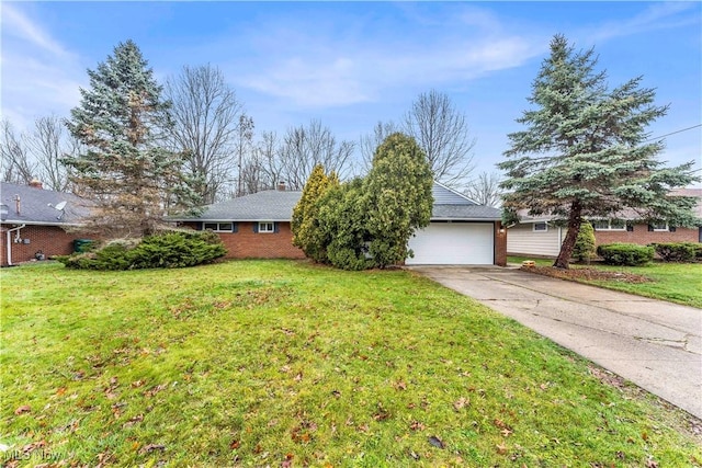 view of front of home featuring a garage and a front lawn