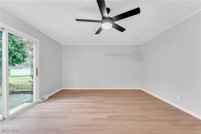 unfurnished room with ceiling fan and light wood-type flooring