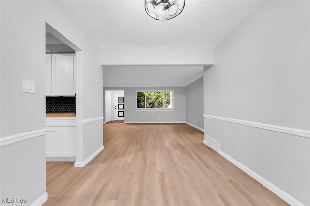 unfurnished living room with light wood-type flooring