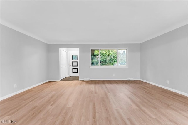 unfurnished living room with light hardwood / wood-style flooring